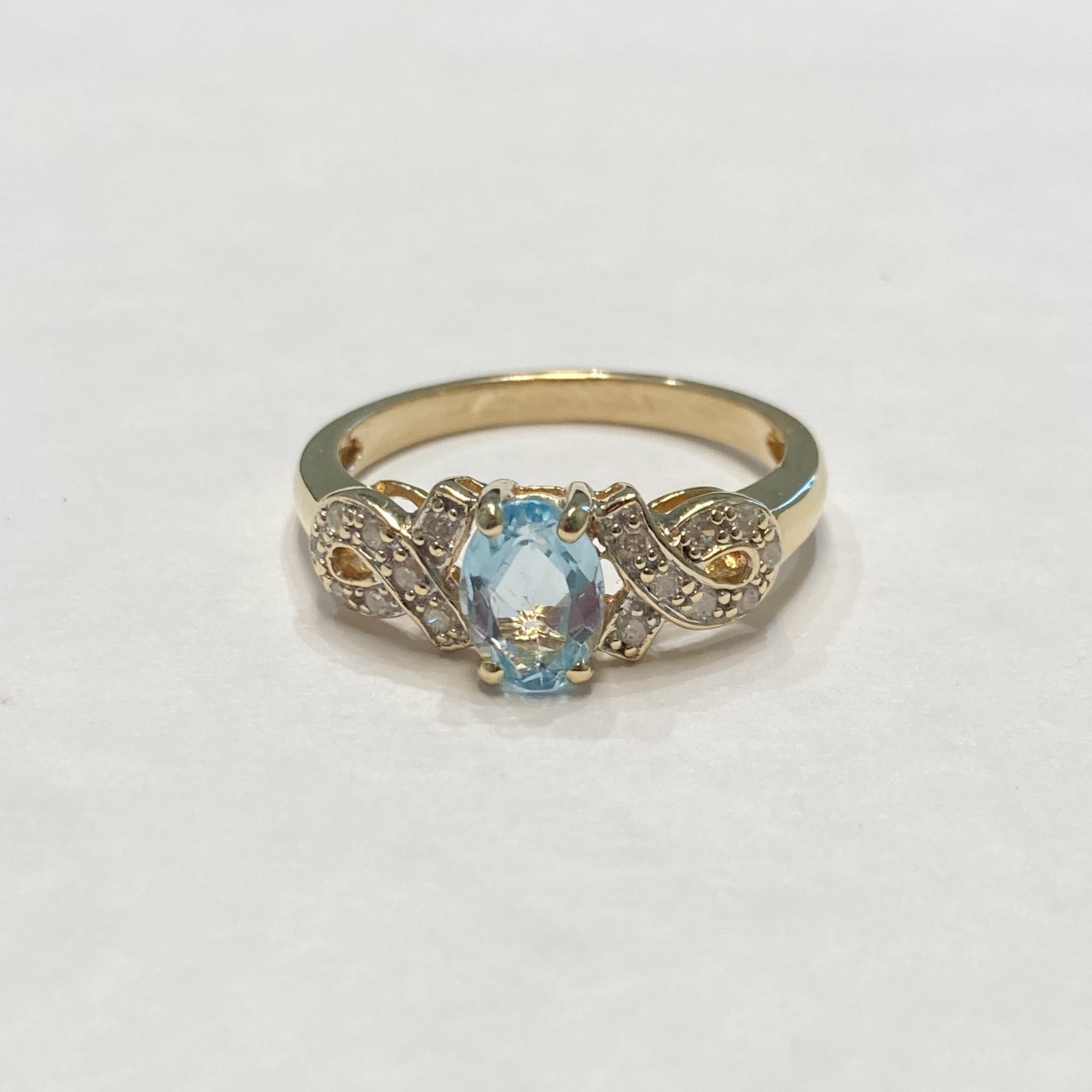 10k Oval Blue Topaz & Melee Diamond Ring