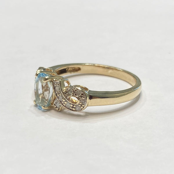 10k Oval Blue Topaz & Melee Diamond Ring