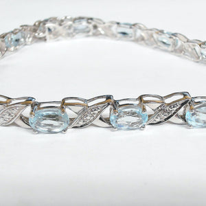 7.5" Sterling Blue Topaz "XOXO" Bracelet